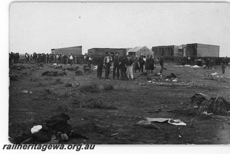 P16819
Commonwealth Railways (CR) - TAR line workers standing in front of camp train at an Unknown location. c1916
