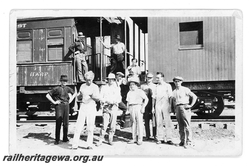 P16822
Commonwealth Railways (CR) - TAR line track workers standing in front of ARP class 11 carriage at an Unknown location. c1916
