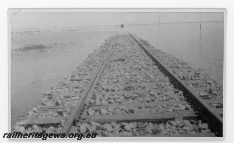 P16826
Commonwealth Railways (CR) - TAR line washaway at Unknown location. Studebaker inspection car in distance.

