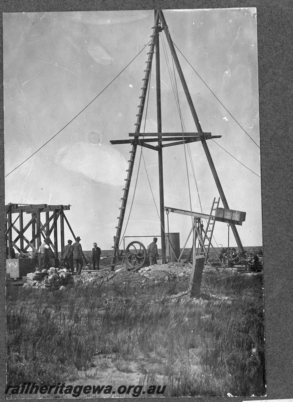 P16834
Commonwealth Railways (CR) - TAR line water drilling rig. Frame of water tank stand on left side of photo. C1916
