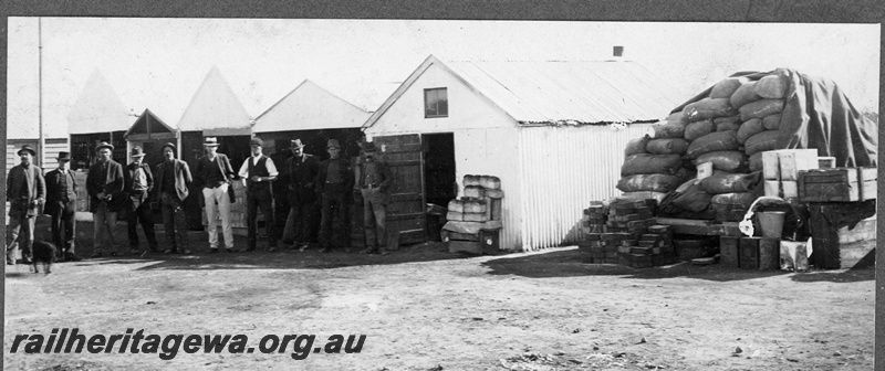 P16835
Commonwealth Railways (CR) - TAR line food store house at Unknown location. Wheel barrow loaded with bread in photo. C1916 
