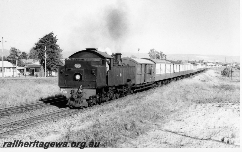 P17694
DD class 596 hauling a special tour train hired by the Girl Guides, west bound on the SWR line between Welshpool and Queens Park, brakevan behind the loco
