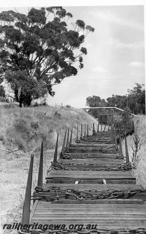 P17748
4 of 9 Rail reclamation on old ER line. C class 1701, short hood leading, on empty reclamation train, pipe bridge, Swan View, ER line

