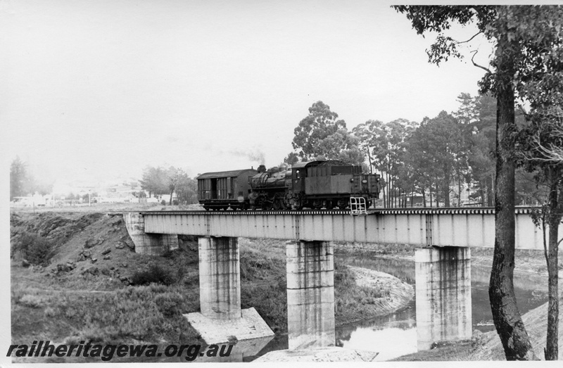 P17755
PMR class 727 steam locomotive on the Muja shunt service crossing the Collie River Bridge. BN line. Note the steel girders on the bridge and the concrete pylons.
