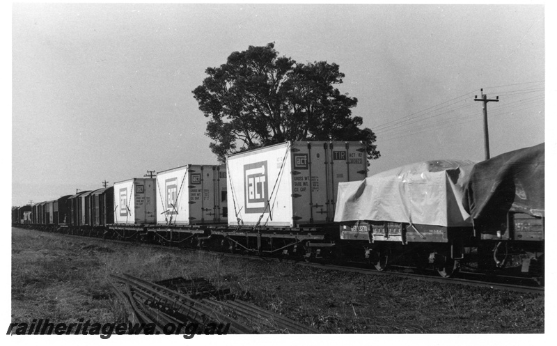 P17760
3 unidentified wagons loaded with A.C.T. containers o 35 Goods to Bunbury. SWR line. Note that chains are the method of securing the containers. 
