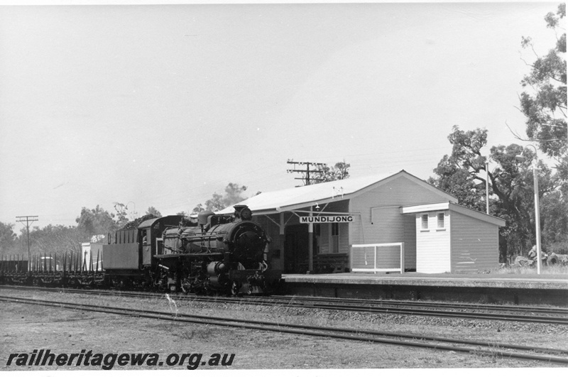 P17761
PMR class 730 steam locomotive with No. 35 Goods, Note the station nameboard, portion of station building and toilet building, at Mundijong. SWR line. 
