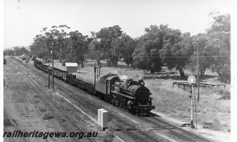 P17762
PMR class 730 steam locomotive with 35 Goods leaving Armadale. SWR line. Note the automatic signal in front of locomotive. Siding trackage to left of train and Station building in distant background.
