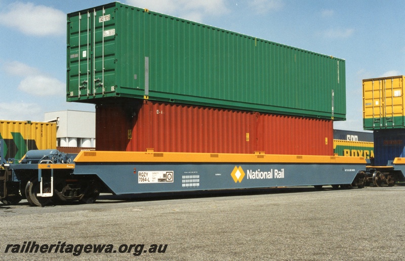 P18004
1 of 3 double stacked container wagons, National Rail RQYZ7064L class wagon, Kewdale yard, Goninan built, one of five permanently coupled together, end and side view
