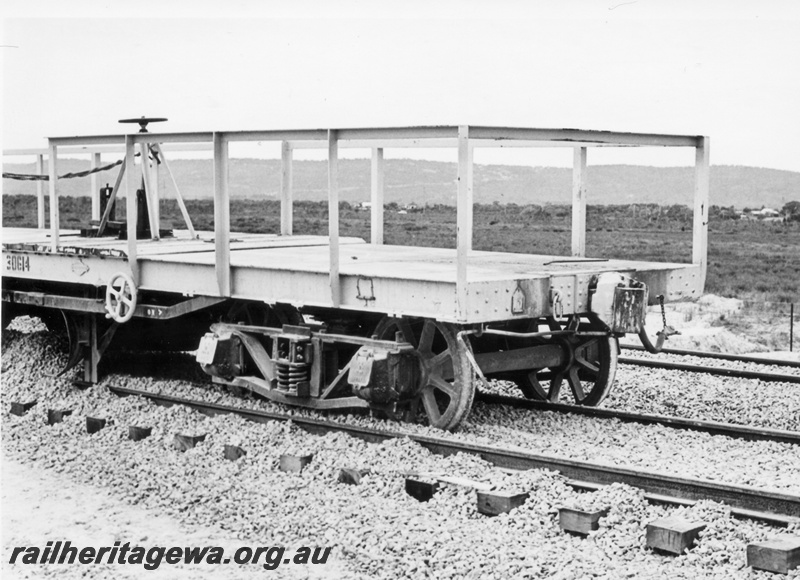 P18017
Derailed wagon, WSP class standard gauge ballast plough, Brixton Street crossing, Kenwick, side and end view of half of wagon
