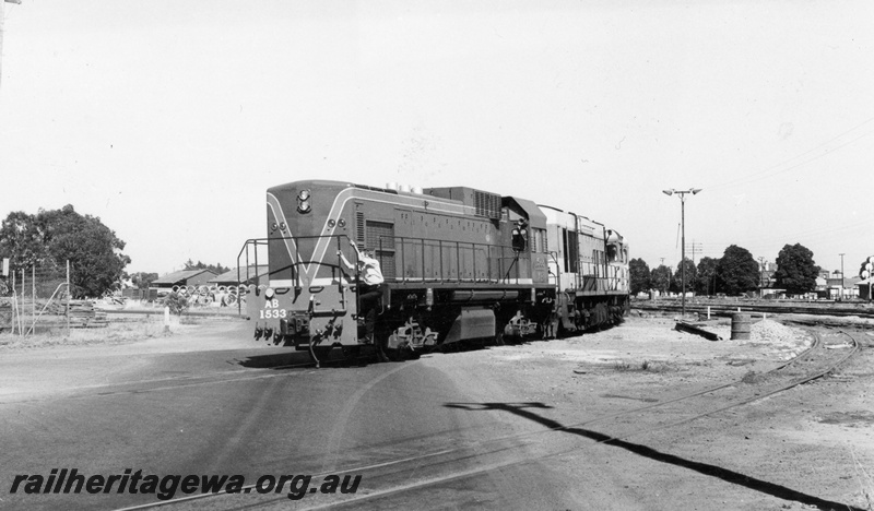 P18105
AB class 1533 diesel locomotive, on standard gauge transfer bogies, being shunted into Midland Workshops by an unidentified K class standard gauge diesel. ER line.
