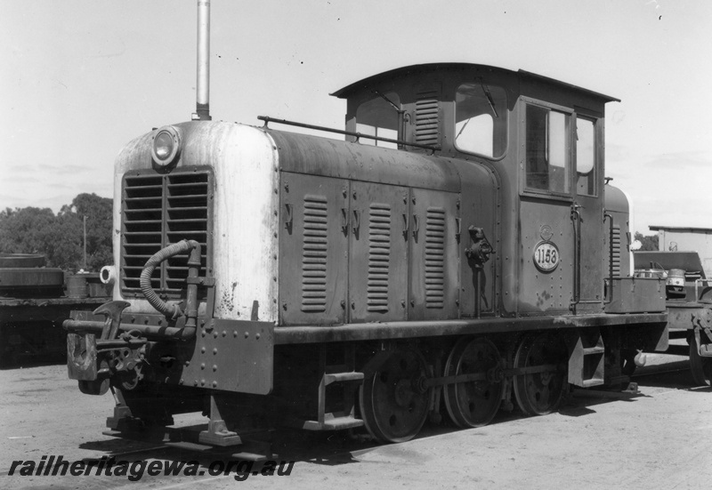 P18127
Z class 1153 diesel mechanical shunting locomotive at Midland Workshops coupled to a shunters wagon. Side view of locomotive.
