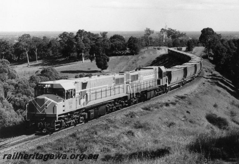 P18131
2 of 3 two unidentified DB class diesel locomotives hauling a loaded bauxite train on the Jarrahdale to Mundijong line.
