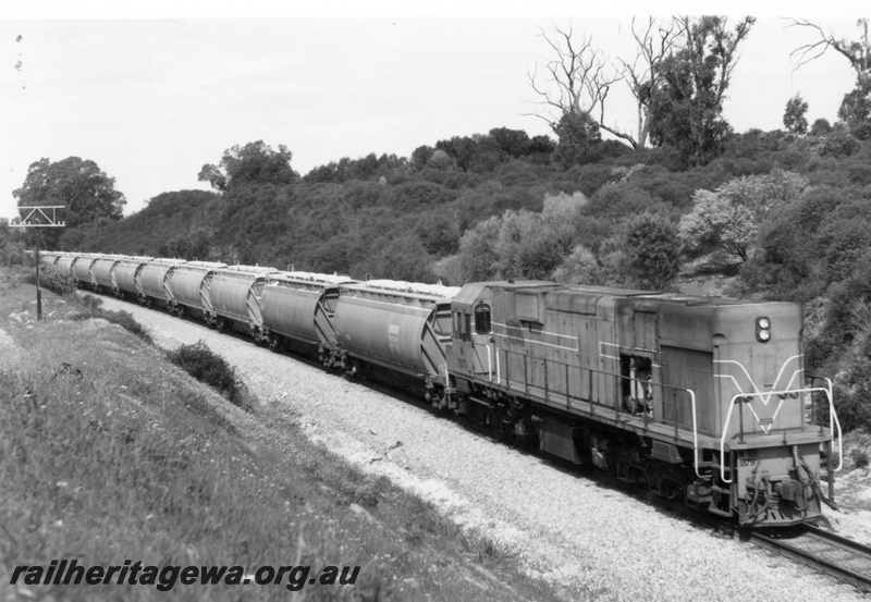 P18133
N class 1879 diesel locomotive hauling a rake of alumina hopper wagons enroute to Kwinana from Pinjarra.
