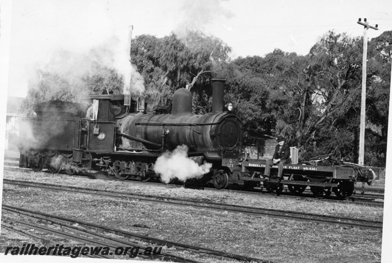 P18193
G class 123, shunter's float with seated, well dressed man, Busselton, BB line
