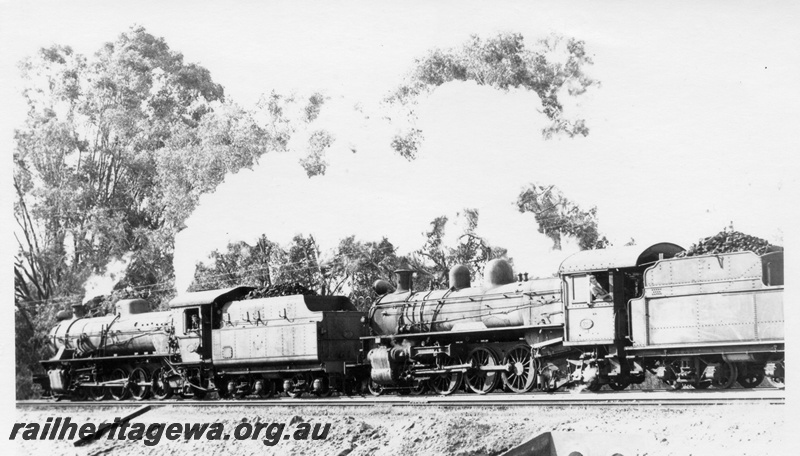 P18195
W class 960 and PR class 526, on No 12 goods train, crossing pipe culvert, side and rear view
