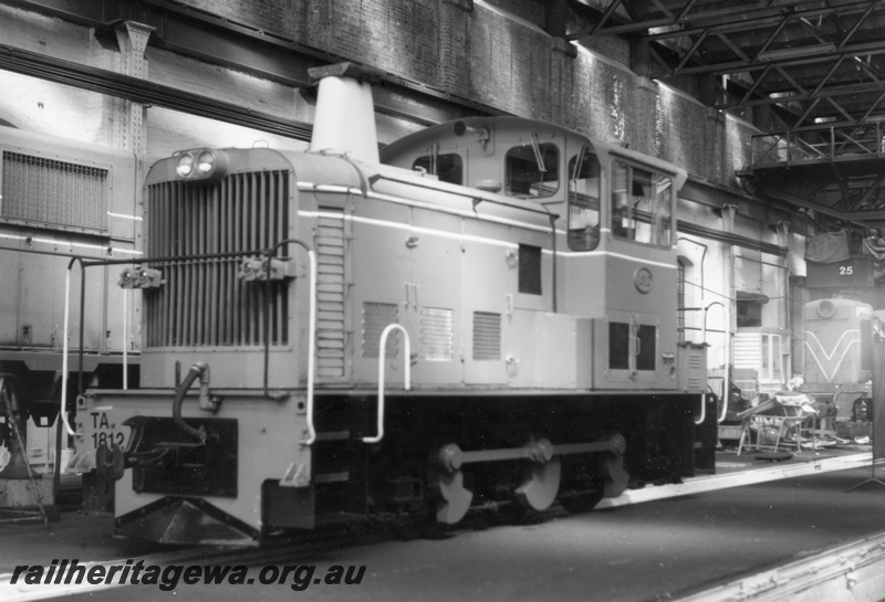 P18229
TA class 1812 diesel electric shunting locomotive, front and side view, in the shed, Midland Workshops.
