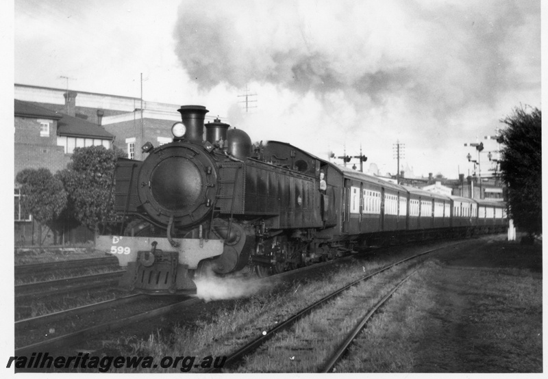 P18320
DD class 599, on suburban train consisting of three AY class carriages and one AYE class carriage, bracket signals, front and side view 
