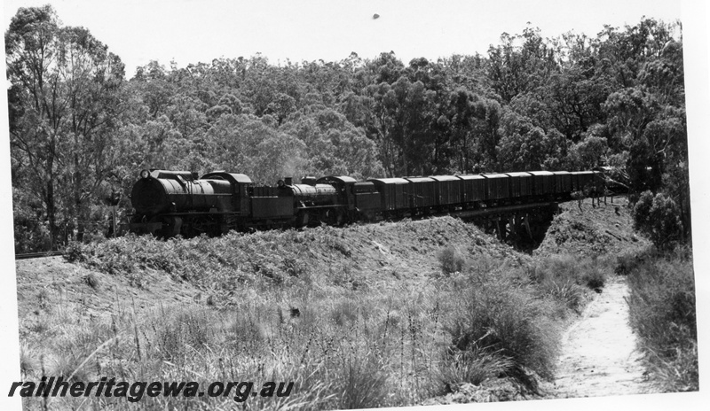 P18455
3 of 5 images of S class 548 and W class 921 double heading Donnybrook to Bridgetown special goods train on PP line, crossing short wooden trestle bridge
