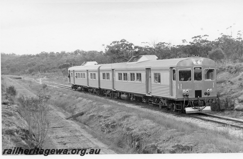 P18467
Two ADK class railcars, on ARHS tour to Wundowie, platform at Mokine in the background, the difference in the level of the abandoned trackbed and the line still in use is noticeable, ER line
