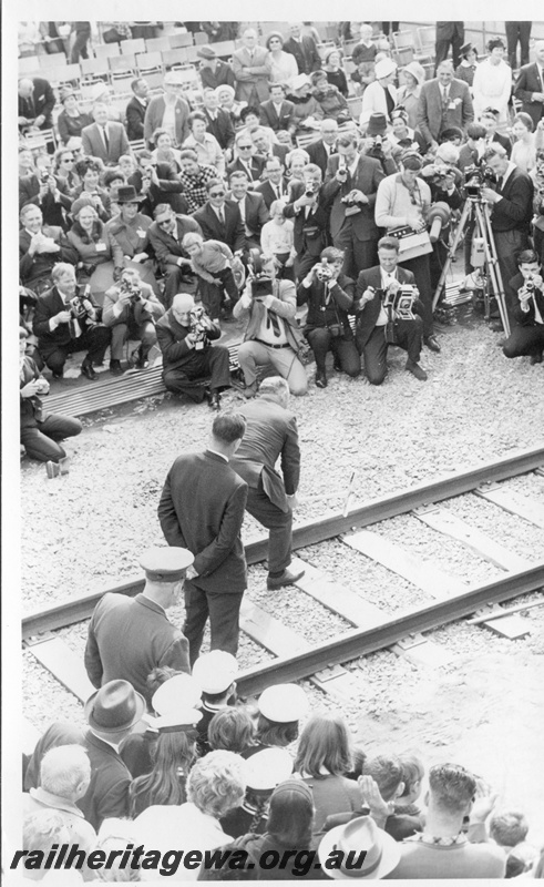 P18478
9 of 12 images relating to the ceremony for the linking of the standard gauge railways at Kalgoorlie, WA Premier Brand drives home the second last gold dog spike to link the standard gauge railways

