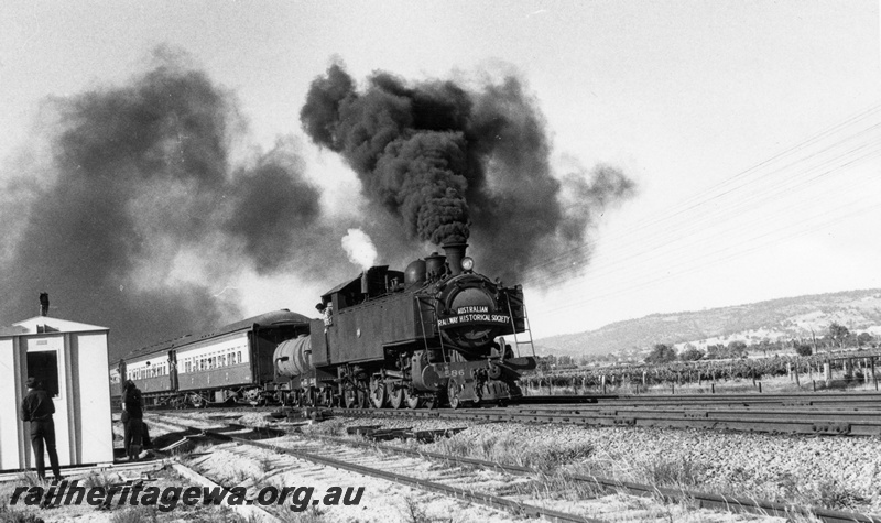 P18591
4 of 7 images of DM class 586 on ARHS tour train to Gingin on MR line, trackside building, vineyards, Millendon Junction, blowing black smoke from Newcastle coal
