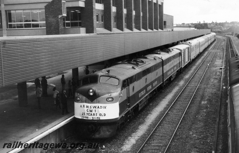 P18619
GM class 1 & GM class 14 diesel locomotives hauling the Trans Australian passenger train into East Perth Terminal. The locomotives were owned by Commonwealth Railways (CR) and are painted in the maroon and silver livery. GM1 was celebrating its 25th Anniversary of entering service. 
