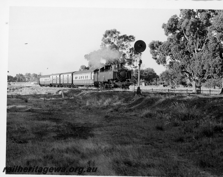 P18710
DD class 598, on passenger train, searchlight signals, rural setting, side and front view
