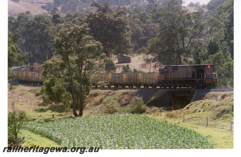 P18721
N class 1880 diesel locomotive hauling a rake of GH class wagons loaded with coal between Beela and Brunswick enroute to Bunbury. BN Line.
