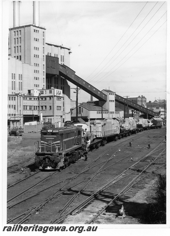 P18728
NSWGR 48 class diesel 116, hauling a train comprising the first three 636 class Alco diesels for use by Cliffs Robe River namely 262-003, 262-004 and 262-005, leaving A E Goodwin works, Sydney, front and side view 
