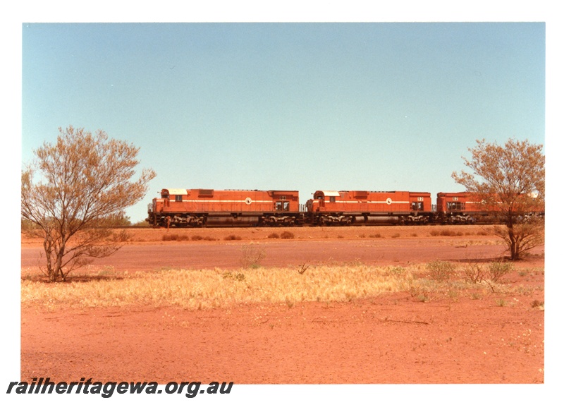 P18732
Mount Newman (MNM) M636 class 5497,C636 class 5452, C636 class 5462 haul empty ore train through Poonda.
