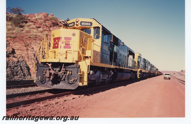 P19035
Hamersley Iron (HI) SD50S class 6063 on loaded iron ore train at Paraburdoo.
