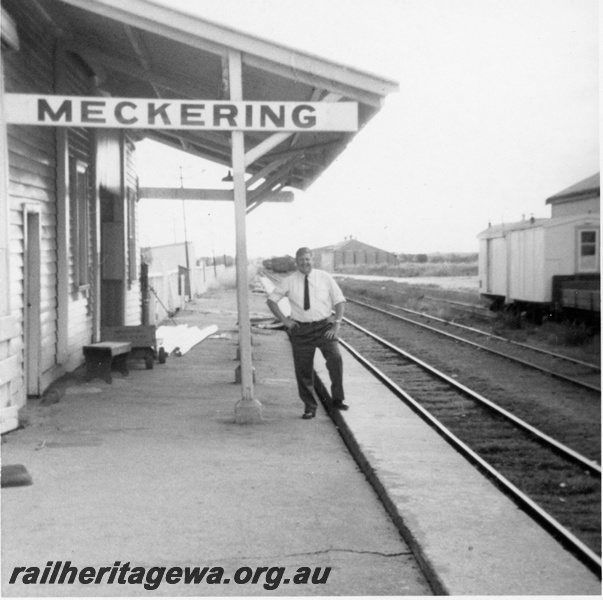 P19120
Malcolm Searle on platform Meckering Station. Wheat bin in background. EGR line.
