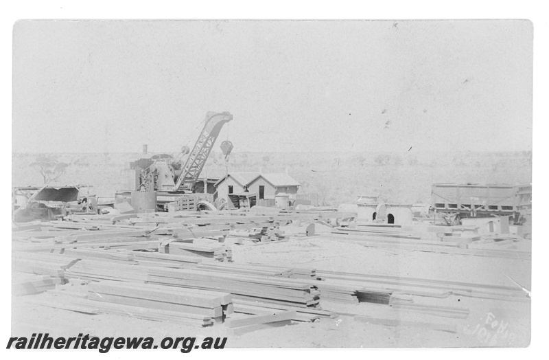 P19176
Commonwealth Railways (CR) yard, wagon, crane, buildings, timber, Port Augusta, TAR line
