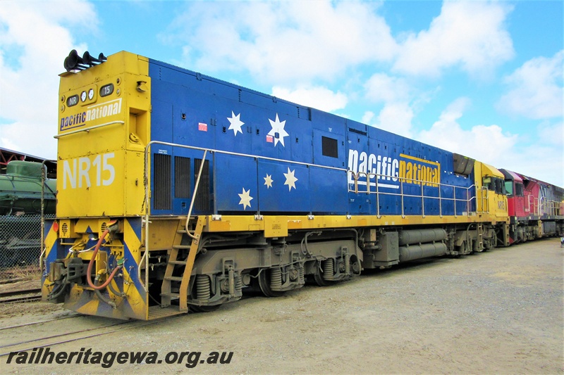 P19310
Pacific National NR class 15, yellow and blue livery, on the site of the Railway Transport Museum, coupled to a Mineral Resources MRL class loco, end and side view
