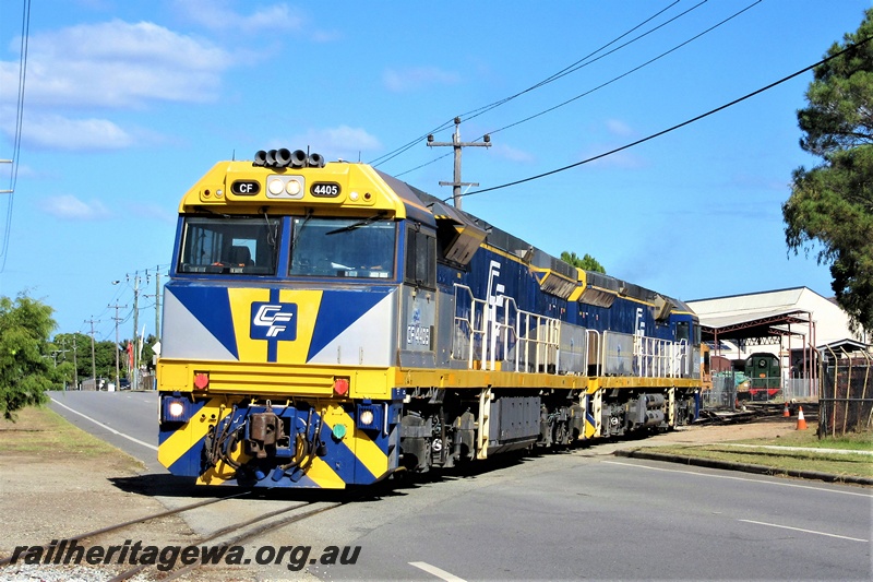 P19311
Chicago Freight CF class 4405, silver and blue livery, coupled to another CF class, crossing Railway Parade, Bassendean, front and side view
