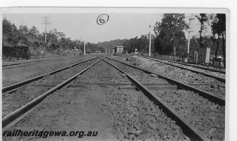 P19657
5 of 5 images of the installation of a double compound (double slip) at Parkerville, ER line. Images 1 & 2 in the sequence are numbered P01052 & P01053. This image, taken at 5pm, shows the finished job, pointwork in position, the line ballasted and ready for service. 
