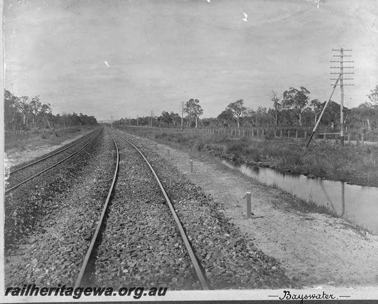 P19672
Bayswater - photo taken early 1900 shows the up and down lines with bush and trees on both sides of the track. ER line
