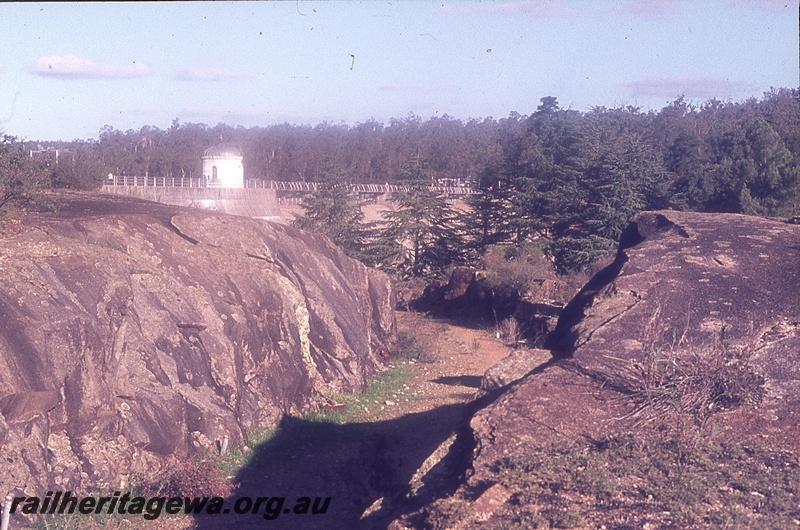 P19721
Weir wall, rotunda on dam wall, granite outcrops, dirt track leading to weir, Mundaring Weir, MW line
