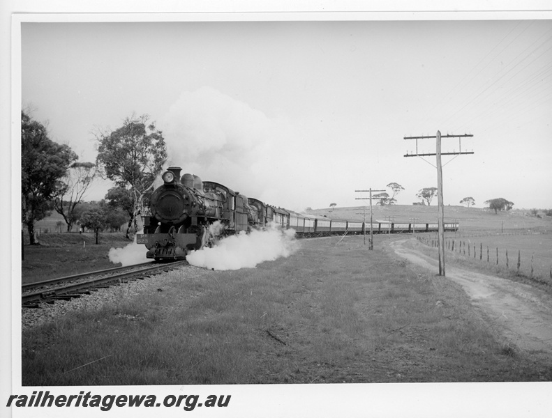 P20004
PR class 523, with another steam loco, double heading passenger train, rural setting, front and side view
