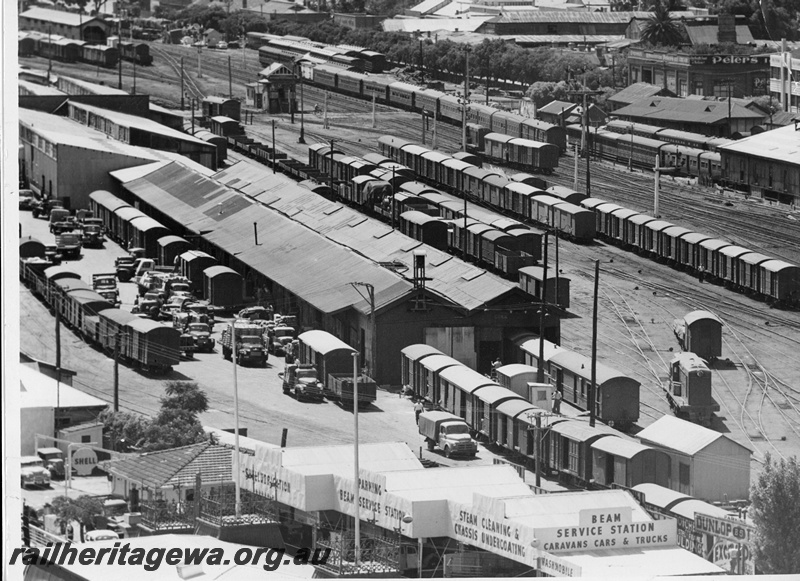 P20020
Overview of Perth goods yard, two Y class diesels shunting, numerous rakes of vans and wagons including three D class advertising vans in bottom right of picture, two of which have 