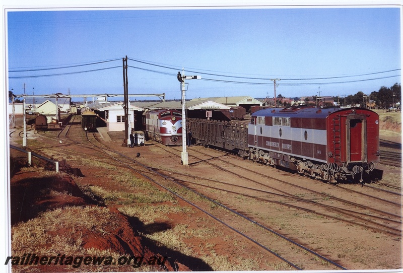 P20051
Commonwealth Railways (CR) GM class 6 diesel locomotive waits while GM class 10 performs shunting duties at the east end of Kalgoorlie Station. Note the WAGR train in the 'Boulder Dock' to the left
