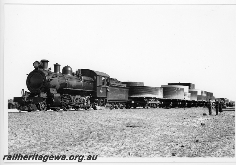 P20104
E class 299, with train load of water tanks, onlookers, Karalee, EGR line, front and side view
