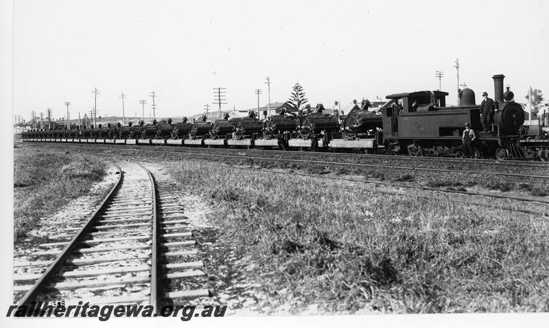 P20137
B class 13, on goods train loaded with harvesters from State Implement Works, North Fremantle, ER line
