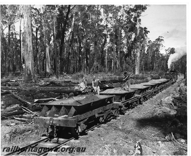 P20141
A class loco, on ballast train, workers, during ballasting of Bunnings line extension from Nyamup to Tone River Mill, end and side view, c1952, 
