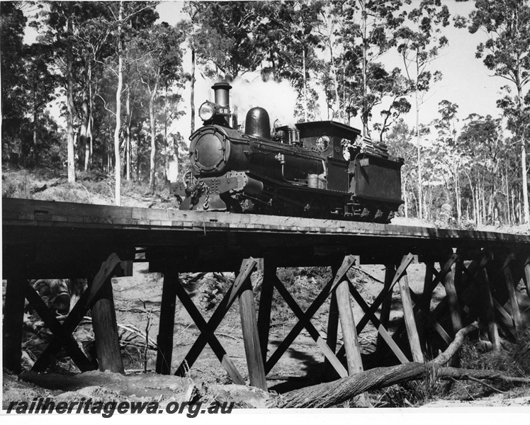 P20144
State Saw Mills loco No 68, (Jas Martin 153/1896), ex WAGR G class 157, on wooden trestle bridge, forest setting, front and side view
