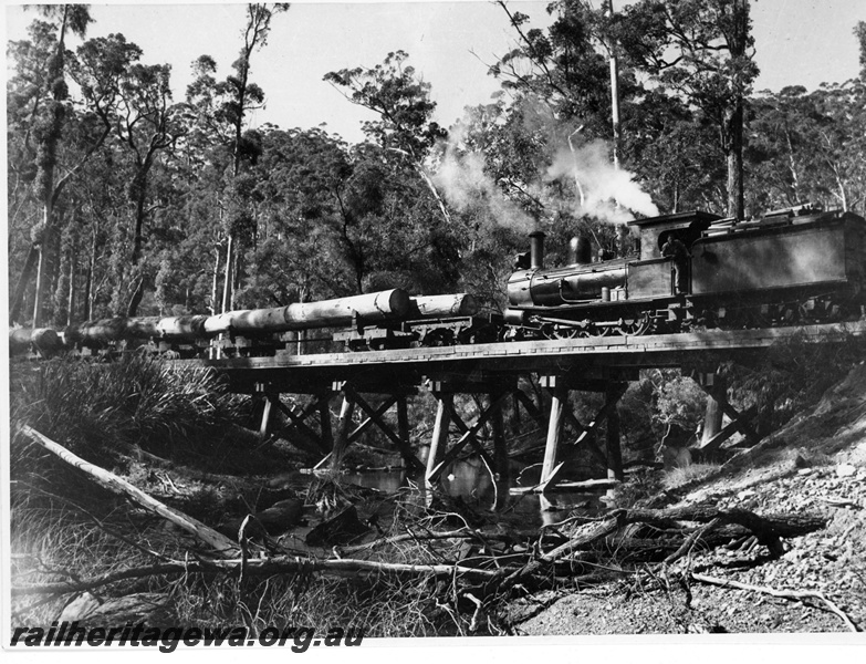P20147
State Saw Mills loco No 68, (James Martin 153/1896), ex WAGR G class 157, hauling log train, on wooden trestle bridge, crossing Donnelly River, Pemberton, side and rear view

