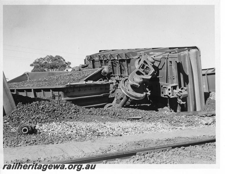 P20167
Derailment of loaded iron ore train near Southern Cross. Photo shows several rolled over WO class wagons and track damage. EGR line.
