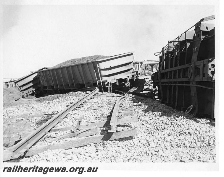 P20171
Derailment of loaded iron ore train near Southern Cross. Photo shows several rolled over WO class wagons and track damage. EGR line.
