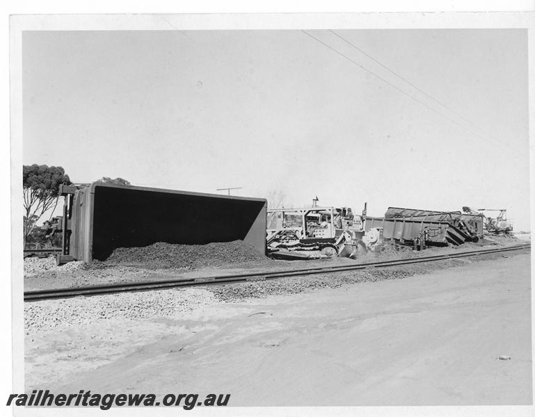 P20172
Derailment of loaded iron ore train near Southern Cross. Photo shows several rolled over WO class wagons and track damage. EGR line.
