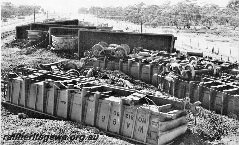 P20728
Standard Gauge loaded iron ore train derailment near Southern Cross. Photo depicts numerous WO class wagons rolled over. EGR line. 
